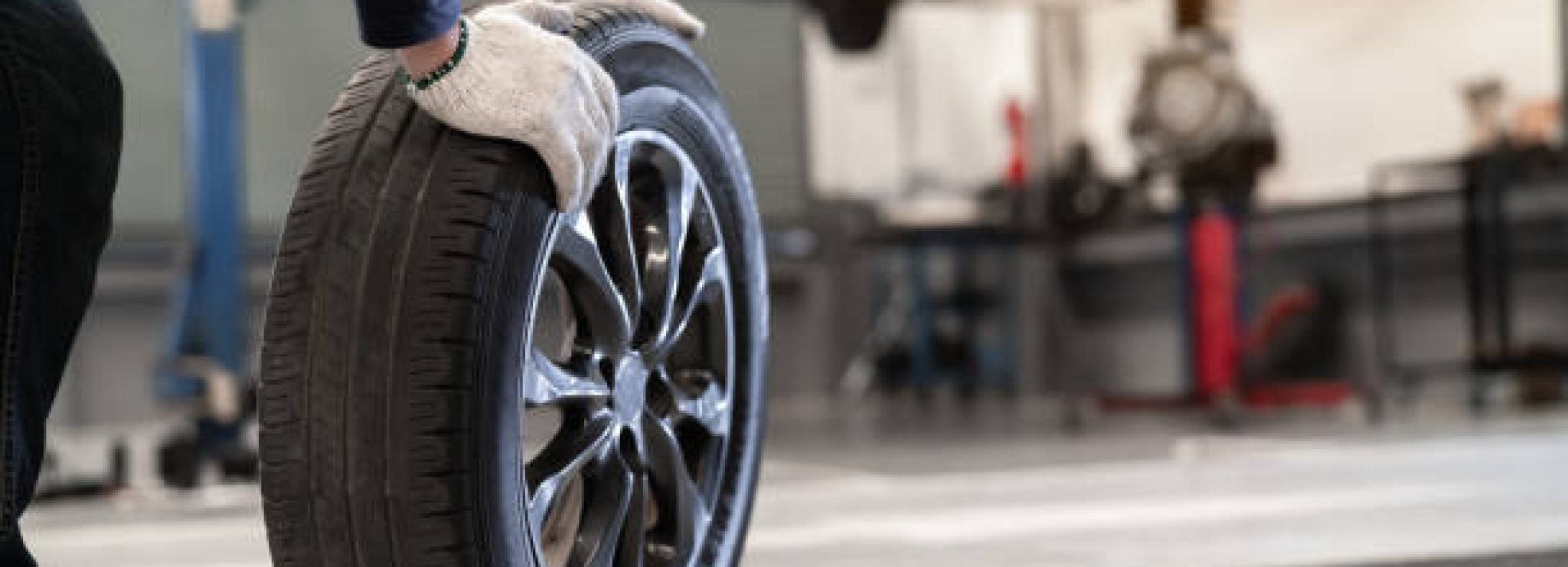 tyre Mechanic man change a wheel tire and service maintenance the suspension of a vehicle , Safety inspection test engine before customer drive a car on a long journey, transportation service